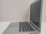 a laptop computer sitting on a table with a white background