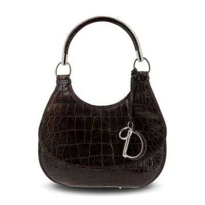 the brown purse has a metal handle and a metal handle