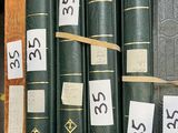 many books that are stacked on top of each other