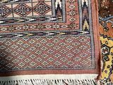 rugs and rugs are laid out on the floor in a room