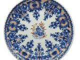 a blue and white plate with a floral design on it