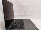a laptop that is sitting on a white surface