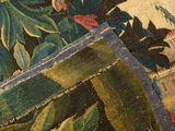 an image of a close up of a rug with flowers and leaves on it