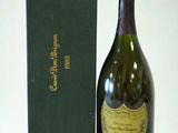 a bottle of champagne next to a green box