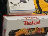 two boxes of tefal products on a table