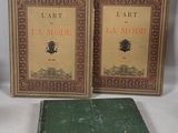 two books are sitting next to each other on a white surface