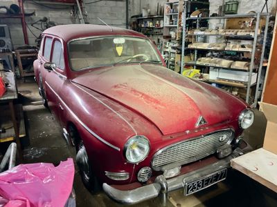 a red car that is parked in a garage