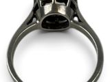 an image of a ring with a black diamond in it