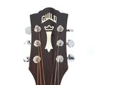 a close up of a guitar headstock on a white background