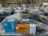 many boxes of food sitting on a table in a warehouse