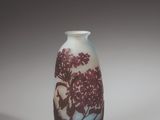 a vase that has a picture of a tree on it