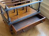 a wooden table with a drawer underneath it on a hard wood floor