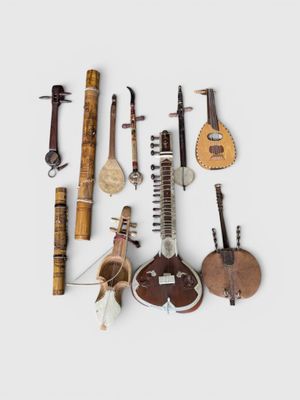 several musical instruments are arranged on a white surface