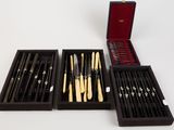 several different types of knives and knives in a black box