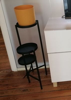 a laptop computer sitting on top of a white desk