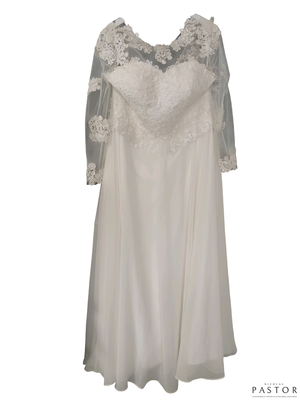 une robe de mariée suspendue à un cintre sur un mur blanc