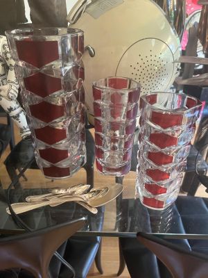 a glass table with a bunch of glasses on top of it