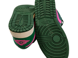 a pair of green and pink shoes on a white background