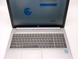 a laptop that is sitting on a white table