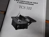 a manual for a table saw that is on the table