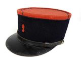navy officer ' s hat with red and black trim