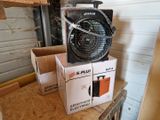 a box with a fan sitting on top of it