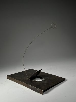 an image of a sculpture of a bird flying through the air