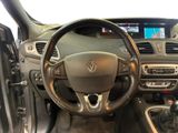 the interior of a car with a steering wheel and dashboard controls
