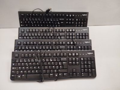 a lot of keyboards that are sitting on a table