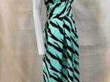 a green and black zebra print dress on a mannequin mannequin mannequin mannequin mannequin mannequin mannequin manne