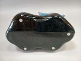 a black purse with a blue bird on top of it
