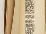 a book open to a page with a picture of a man riding a horse