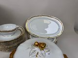 a lot of plates and bowls that are on a table