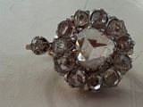 a ring that has a large crystal stone in it