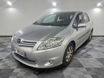 a picture of a silver car parked in a garage