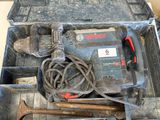 a tool box with tools in it sitting on the floor