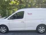 a white van that is parked in a parking lot