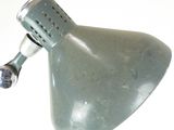 a green lamp that is on a white table
