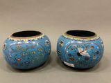 pair of blue vases with birds and flowers painted on them