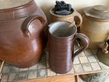 many different types of pottery on display in this room
