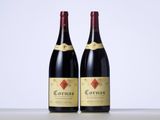 two bottles of wine sitting on top of a table next to each other