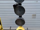 a traffic light that is sitting next to a ladder
