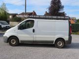 a white van that is parked in a parking lot