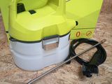 the yellow and white sprayer is sitting on the floor next to the box