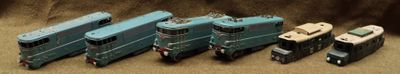 a group of toy trains sitting next to each other on a table