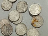 a lot of coins that are on the table