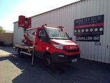 a red and black truck parked in front of a building