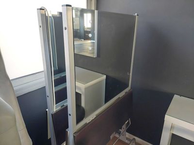a bathroom with a sink and a mirror in it