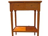 a small wooden table with two drawers on it