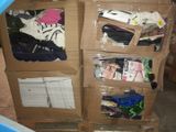 a cardboard box with a bunch of clothes inside of it
